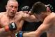 Mar 16, 2013; Montreal, Quebec, CAN; Georges St.Pierre (red) and Nick Diaz (blue) exchange blows during their Welterweight title bout at UFC 158 at the Bell Centre. Mandatory Credit: Eric Bolte-USA TODAY Sports
