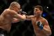 Mar 16, 2013; Montreal, Quebec, CAN; Nick Diaz (blue) lands a punch on Georges St.Pierre (red) during their Welterweight title bout at UFC 158 at the Bell Centre. Mandatory Credit: Eric Bolte-USA TODAY Sports