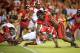 LINCOLN, NE - SEPTEMBER 29: Defensive end Jason Ankrah #9 and linebacker Will Compton #51 of the Nebraska Cornhuskers wraps up running back Melvin Gordon #25 of the Wisconsin Badgers during their game at Memorial Stadium on September 29, 2012 in Lincoln, Nebraska. (Photo by Eric Francis/Getty Images)