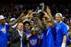 KANSAS CITY, MO - MARCH 16: The Kansas Jayhawks and head coach Bill Self celebrate with the trophy after their 70-54 win over the Kansas State Wildcats during the Final of the Big 12 basketball tournament at Sprint Center on March 16, 2013 in Kansas City, Missouri. (Photo by Jamie Squire/Getty Images)