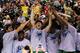 LAS VEGAS, NV - MARCH 16: The Oregon Ducks celebrate their 78 to 69 win over the UCLA Bruins in the Pac-12 Championship game at MGM Grand Garden Arena on March 16, 2013 in Las Vegas, Nevada. (Photo by Jeff Gross/Getty Images)