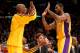 LOS ANGELES, CA - FEBRUARY 20: Earl Clark #6 of the Los Angeles Lakers is greeted by Kobe Bryant #24 as he returns to the bench after a substitution against the Boston Celtics at Staples Center on February 20, 2013 in Los Angeles, California. The Lakers won 113-99. NOTE TO USER: User expressly acknowledges and agrees that, by downloading and or using this photograph, User is consenting to the terms and conditions of the Getty Images License Agreement. (Photo by Stephen Dunn/Getty Images)