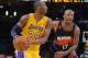 Feb 12, 2013; Los Angeles, CA, USA; Los Angeles Lakers guard Kobe Bryant (24) is defended by Phoenix Suns forward P.J. Tucker (17) at the Staples Center. The Lakers defeated the Suns 91-85. Mandatory Credit: Kirby Lee/USA TODAY Sports