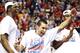 NASHVILLE, TN - MARCH 17: Marshall Henderson #22 of the Ole Miss Rebels celebrates with teammates after their 66 to 63 win over the Florida Gators in the SEC Basketball Tournament Championship game at Bridgestone Arena on March 17, 2013 in Nashville, Tennessee. (Photo by Andy Lyons/Getty Images)