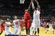 NASHVILLE, TN - MARCH 17: Reginald Buckner #23 of the Ole Miss Rebels goes up between Will Yeguete #15 and Erik Murphy #33 of the Florida Gators in the second half of the SEC Basketball Tournament Championship game at Bridgestone Arena on March 17, 2013 in Nashville, Tennessee. (Photo by Andy Lyons/Getty Images)
