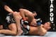 Mar 16, 2013; Montreal, Quebec, CAN; Nick Diaz (blue) throws punches at Georges St.Pierre (red) during their Welterweight title bout at UFC 158 at the Bell Centre. Mandatory Credit: Eric Bolte-USA TODAY Sports