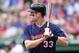 Aug 26, 2012; Arlington, TX, USA; Minnesota Twins designated hitter Justin Morneau (33) at bat during the first inning of the game against the Texas Rangers at Rangers Ballpark. Mandatory Credit: Tim Heitman-USA TODAY Sports