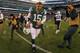 Dec 23, 2012; East Rutherford, NJ, USA; New York Jets quarterback Tim Tebow (15) runs off the field after the Jets 27-17 loss to the San Diego Chargers at MetLIfe Stadium. The Chargers defeated the Jets 27-17. Mandatory Credit: Ed Mulholland-USA TODAY Sports