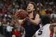 March 11, 2013; Las Vegas, NV, USA; Saint Mary's Gaels guard Matthew Dellavedova (4) shoots against the Gonzaga Bulldogs during the second half in the finals of the West Coast Conference tournament at Orleans Arena. Mandatory Credit: Kyle Terada-USA TODAY Sports