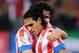 MADRID, SPAIN - NOVEMBER 25: Radamel Falcao (R) of Club Atletico de Madrid celebrates with Tiago Cardoso after being awarded a penalty kick during the La Liga match between Club Atletico de Madrid and Sevilla FC at Vicente Calderon Stadium on November 25, 2012 in Madrid, Spain. (Photo by Denis Doyle/Getty Images)