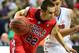 Mar 17, 2013; Nashville, TN, USA; Mississippi Rebels guard Marshall Henderson (22) drives against the Florida Gators during the championship game of the SEC tournament at Bridgestone Arena. The Rebels beat the Gators 66-63. Mandatory Credit: Don McPeak-USA TODAY Sports