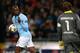 MANCHESTER, ENGLAND - OCTOBER 03: Mario Balotelli of Manchester City gestures to Roman Weidenfeller of Borussia Dortmund after scoring an equalising penalty kick during the UEFA Champions League Group D match between Manchester City and Borussia Dortmund at the Etihad Stadium on October 3, 2012 in Manchester, England. (Photo by Alex Livesey/Getty Images)