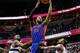 WASHINGTON, DC - FEBRUARY 27: Greg Monroe #10 of the Detroit Pistons puts up a shot between Emeka Okafor #50 (L) and A.J. Price #12 of the Washington Wizards during the first half at Verizon Center on February 27, 2013 in Washington, DC. NOTE TO USER: User expressly acknowledges and agrees that, by downloading and or using this photograph, User is consenting to the terms and conditions of the Getty Images License Agreement. (Photo by Rob Carr/Getty Images)