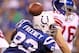INDIANAPOLIS - SEPTEMBER 19: Dwight Freeney #93 of the Indianapolis Colts hits Eli Manning #10 of the New York Giants causing a fumble during the NFL game at Lucas Oil Stadium on September 19, 2010 in Indianapolis, Indiana. (Photo by Andy Lyons/Getty Images)