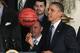 WASHINGTON, DC - MAY 04: Wildcat Coach John Calipari watches as U.S. President Barack Obama plays with a ball given to him by the University of Kentucky basketball team during an event in the East Room at the White House, on May 4, 2012 in Washington, DC. President Obama was honoring the Kentucky Wildcats for winning its eighth NCAA national championship. (Photo by Mark Wilson/Getty Images)