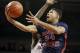 FAYETTEVILLE, AR - DECEMBER 20: Russell Johnson #34 of the Robert Morris Colonials drives to the basket against the Arkansas Razorbacks at Bud Walton Arena on December 20, 2012 in Fayetteville, Arkansas. The Razorbacks defeated the Colonials 79-74. (Photo by Wesley Hitt/Getty Images)
