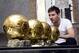 Jan 9, 2013; Barcelona, SPAIN; Lionel Messi poses with his four Ballon d'Or trophies aka golden ball trophies after winning the World Player accolade for a fourth straight year. Mandatory Credit: Rondeau/Presse Sports via USA TODAY Sports