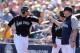 PEORIA, AZ - MARCH 04: Raul Ibanez #28 of the Seattle Mariners high fives manager Eric Wedge after Ibanez scored a first inning run against the Colorado Rockies during the spring training game at Peoria Stadium on March 4, 2013 in Peoria, Arizona. (Photo by Christian Petersen/Getty Images)