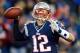 FOXBORO, MA - JANUARY 20: Tom Brady #12 of the New England Patriots looks to throw against the Baltimore Ravens during the 2013 AFC Championship game at Gillette Stadium on January 20, 2013 in Foxboro, Massachusetts. (Photo by Jim Rogash/Getty Images)