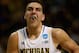 AUBURN HILLS, MI - MARCH 21: Mitch McGary #4 of the Michigan Wolverines drives to the basket against the South Dakota State Jackrabbits during the second round of the 2013 NCAA Men's Basketball Tournament at The Palace of Auburn Hills on March 21, 2013 in Auburn Hills, Michigan. Michigan defeated South Dakota State 71-56. (Photo by Jonathan Daniel/Getty Images)