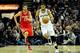 SAN ANTONIO, TX - DECEMBER 28: Chandler Parsons #25 of the Houston Rockets pursues Tim Duncan #21 of the San Antonio Spurs during a game at AT&T Center on December 28, 2012 in San Antonio, Texas. San Antonio won the game 122-116. NOTE TO USER: User expressly acknowledges and agrees that, by downloading and or using this photogrpah, User is consenting to the terms and conditions of the Getty Images License Agreement. (Photo by Stacy Revere/Getty Images)