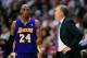 January 4, 2013; Los Angeles, CA, USA; Los Angeles Lakers head coach Mike D'Antoni speaks to shooting guard Kobe Bryant (24) during a stoppage in play against the Los Angeles Clippers during the second half at Staples Center. Mandatory Credit: Gary A. Vasquez-USA TODAY Sports