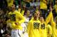 AUBURN HILLS, MI - MARCH 23: Players for the Michigan Wolverines react on the bench in the second half against the Virginia Commonwealth Rams during the third round of the 2013 NCAA Men's Basketball Tournament at The Palace of Auburn Hills on March 23, 2013 in Auburn Hills, Michigan. (Photo by Jonathan Daniel/Getty Images)