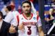 LEXINGTON, KY - MARCH 23: Peyton Siva #3 of the Louisville Cardinals gestures as he walks off the court after defeating the Colorado State Rams during the third round of the 2013 NCAA Men's Basketball Tournament at Rupp Arena on March 23, 2013 in Lexington, Kentucky. (Photo by Kevin C. Cox/Getty Images)