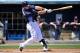 Mar 10, 2012; Port Charlotte, FL, USA; Tampa Bay Rays third baseman Evan Longoria (3) drives in a run during the third inning against the Boston Red Sox at Charlotte Sports Park. Mandatory Credit: Jerome Miron-USA TODAY Sports
