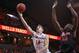 March 24, 2013; Charlottesville, VA, USA; Virginia Cavaliers guard Joe Harris (12) shoots the ball as St. John's Red Storm forward/center Chris Obekpa (12) defends in the second half during the NIT tournament at John Paul Jones Arena. The Cavaliers won 68-50. Mandatory Credit: Geoff Burke-USA TODAY Sports