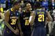 KANSAS CITY, MO - MARCH 24: (L-R) Rohan Brown #35, Sam Mills #10 and Tyrone Garland #21 of the La Salle Explorers celebrate after Garland made the game winning shot to give them a 76-74 win against the Mississippi Rebels during the third round of the 2013 NCAA Men's Basketball Tournament at Sprint Center on March 24, 2013 in Kansas City, Missouri. (Photo by Ed Zurga/Getty Images)