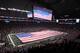 ARLINGTON, TX - JANUARY 06: An American flag covers the field as The Band Perry performs the national anthem before a game between the Arkansas Razorbacks and the Kansas State Wildcats during the Cotton Bowl at Cowboys Stadium on January 6, 2012 in Arlington, Texas. (Photo by Ronald Martinez/Getty Images)