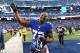 EAST RUTHERFORD, NJ - DECEMBER 30: Osi Umenyiora #72 of the New York Giants waves to the crowd after a 42-7 win against the Philadelphia Eagles at MetLife Stadium on December 30, 2012 in East Rutherford, New Jersey. (Photo by Al Bello/Getty Images)