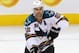 WINNIPEG, CANADA - JANUARY 12: Dan Boyle #22 of the San Jose Sharks passes the puck in a game against the Winnipeg Jets in NHL action at the MTS Centre on January 12, 2012 in Winnipeg, Manitoba, Canada. (Photo by Marianne Helm/Getty Images)