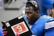 Oct 28, 2012; Detroit, MI, USA; Detroit Lions outside linebacker Justin Durant (52) looks over the playbook on the bench in the fourth quarter against the Seattle Seahawks at Ford Field. Detroit Lions defeated the Seattle Seahawks 28-24. Mandatory Credit: Andrew Weber-USA TODAY Sports