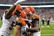 HOUSTON, TX - JANUARY 05: Leon Hall #29 of the Cincinnati Bengals celebrates with teammates after he returned an interception 21-yards for a touchdown in the second quarter against the Houston Texans during their AFC Wild Card Playoff Game at Reliant Stadium on January 5, 2013 in Houston, Texas. (Photo by Bob Levey/Getty Images)