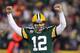 GREEN BAY, WI - JANUARY 05: Quarterback Aaron Rodgers #12 of the Green Bay Packers celebrates after fullback John Kuhn #30 scores on a three-yard touchdown run in the second quarter against the Minnesota Vikings during the NFC Wild Card Playoff game at Lambeau Field on January 5, 2013 in Green Bay, Wisconsin. (Photo by Andy Lyons/Getty Images)