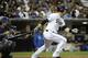 SAN DIEGO, CA - SEPTEMBER 25: Yasmani Grandal #12 of the San Diego Padres grounds out but scores Logan Forsythe during the fourth inning of a baseball game against the Los Angeles Dodgers at Petco Park on September 25, 2012 in San Diego, California. (Photo by Denis Poroy/Getty Images)