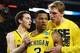 ARLINGTON, TX - MARCH 29: Trey Burke #3 of the Michigan Wolverines reacts after shooting a game tying three pointer with teammates in the final seconds of the second half againist the Kansas Jayhawks during the South Regional Semifinal round of the 2013 NCAA Men's Basketball Tournament at Dallas Cowboys Stadium on March 29, 2013 in Arlington, Texas. (Photo by Tom Pennington/Getty Images)