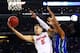ARLINGTON, TX - MARCH 29: Scottie Wilbekin #5 of the Florida Gators goes up against Sherwood Brown #25 of the Florida Gulf Coast Eagles in the second half during the South Regional Semifinal round of the 2013 NCAA Men's Basketball Tournament at Dallas Cowboys Stadium on March 29, 2013 in Arlington, Texas. (Photo by Ronald Martinez/Getty Images)