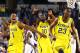 ARLINGTON, TX - MARCH 29: Glenn Robinson III #1, Tim Hardaway Jr. #10 and Caris LeVert #23 of the Michigan Wolverines celebrate their 87 to 85 win over the Kansas Jayhawks in overtime during the South Regional Semifinal round of the 2013 NCAA Men's Basketball Tournament at Dallas Cowboys Stadium on March 29, 2013 in Arlington, Texas. (Photo by Tom Pennington/Getty Images)