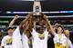 ARLINGTON, TX - MARCH 31: Tim Hardaway Jr. #10 of the Michigan Wolverines and teammate celebrate their 79 to 59 win ovewr the Florida Gators during the South Regional Round Final of the 2013 NCAA Men's Basketball Tournament at Dallas Cowboys Stadium on March 31, 2013 in Arlington, Texas. (Photo by Ronald Martinez/Getty Images)