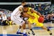 ARLINGTON, TX - MARCH 31: Trey Burke #3 of the Michigan Wolverines drives against Scottie Wilbekin #5 of the Florida Gators in the first half during the South Regional Round Final of the 2013 NCAA Men's Basketball Tournament at Dallas Cowboys Stadium on March 31, 2013 in Arlington, Texas. (Photo by Ronald Martinez/Getty Images)