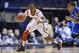 Mar 31, 2013; Indianapolis, IN, USA; Louisville Cardinals guard Russ Smith (2) chases down a loose ball against the Duke Blue Devils in the first half during the finals of the Midwest regional of the 2013 NCAA tournament at Lucas Oil Stadium. Mandatory Credit: Jamie Rhodes-USA TODAY Sports