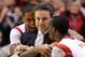 INDIANAPOLIS, IN - MARCH 31: (L-R) Chane Behanan #21, head coach Rick Pitino and Russ Smith #2 of the Louisville Cardinals celebrate in the final minute as they won 85-63 against the Duke Blue Devils during the Midwest Regional Final round of the 2013 NCAA Men's Basketball Tournament at Lucas Oil Stadium on March 31, 2013 in Indianapolis, Indiana. (Photo by Andy Lyons/Getty Images)