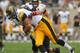 CHICAGO, IL - SEPTEMBER 01: C.J. Fiedorowicz #86 of the Iowa Hawkeyes runs after a catch as Victor Jacques #40 of the Northern Illinois Huskies moves in for the tackle at Soldier Field on September 1, 2012 in Chicago, Illinois. Iowa defeated Northern Illinois 18-17. (Photo by Jonathan Daniel/Getty Images)