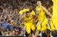 Mar 29, 2013; Arlington, TX, USA; Michigan Wolverines guard Trey Burke (3) celebrates the overtime victory over the Kansas Jayhawks during the semifinals of the South regional of the 2013 NCAA Tournament at Cowboys Stadium. Mandatory Credit: Kevin Jairaj-USA TODAY Sports