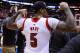 Mar 31, 2013; Indianapolis, IN, USA; Louisville Cardinals forward Chane Behanan celebrates while wearing the jersey of teammate Kevin Ware (not pictured) after the finals of the Midwest regional of the 2013 NCAA tournament against the Duke Blue Devils at Lucas Oil Stadium. Louisville won 85-63. Mandatory Credit: Brian Spurlock-USA TODAY Sports