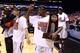 INDIANAPOLIS, IN - MARCH 31: Russ Smith #2 of the Louisville Cardinals celebrates with the MIdwest regional championship trophy after they won 85-63 against the Duke Blue Devils during the Midwest Regional Final round of the 2013 NCAA Men's Basketball Tournament at Lucas Oil Stadium on March 31, 2013 in Indianapolis, Indiana. (Photo by Streeter Lecka/Getty Images)