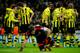 MADRID, SPAIN - NOVEMBER 06: Mario Gotze (2nd L) of Borussia Dortmund celebrates with his teammates after scoring his sides second goal as Goalkeeper Iker Casillas of Real Madrid sits dejected on the pitch during the UEFA Champions League group D match between Real Madrid and Borussia Dortmund at Estadio Santiago Bernabeu on November 6, 2012 in Madrid, Spain. (Photo by Jasper Juinen/Getty Images)